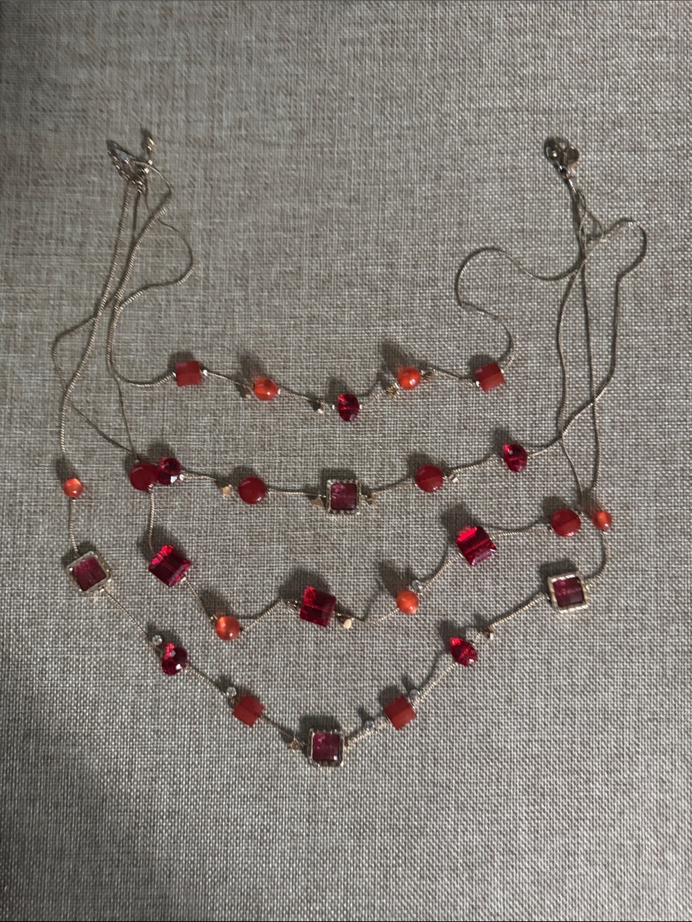 Gold-Tone Layered Necklace with Red and Orange Crystal Accents